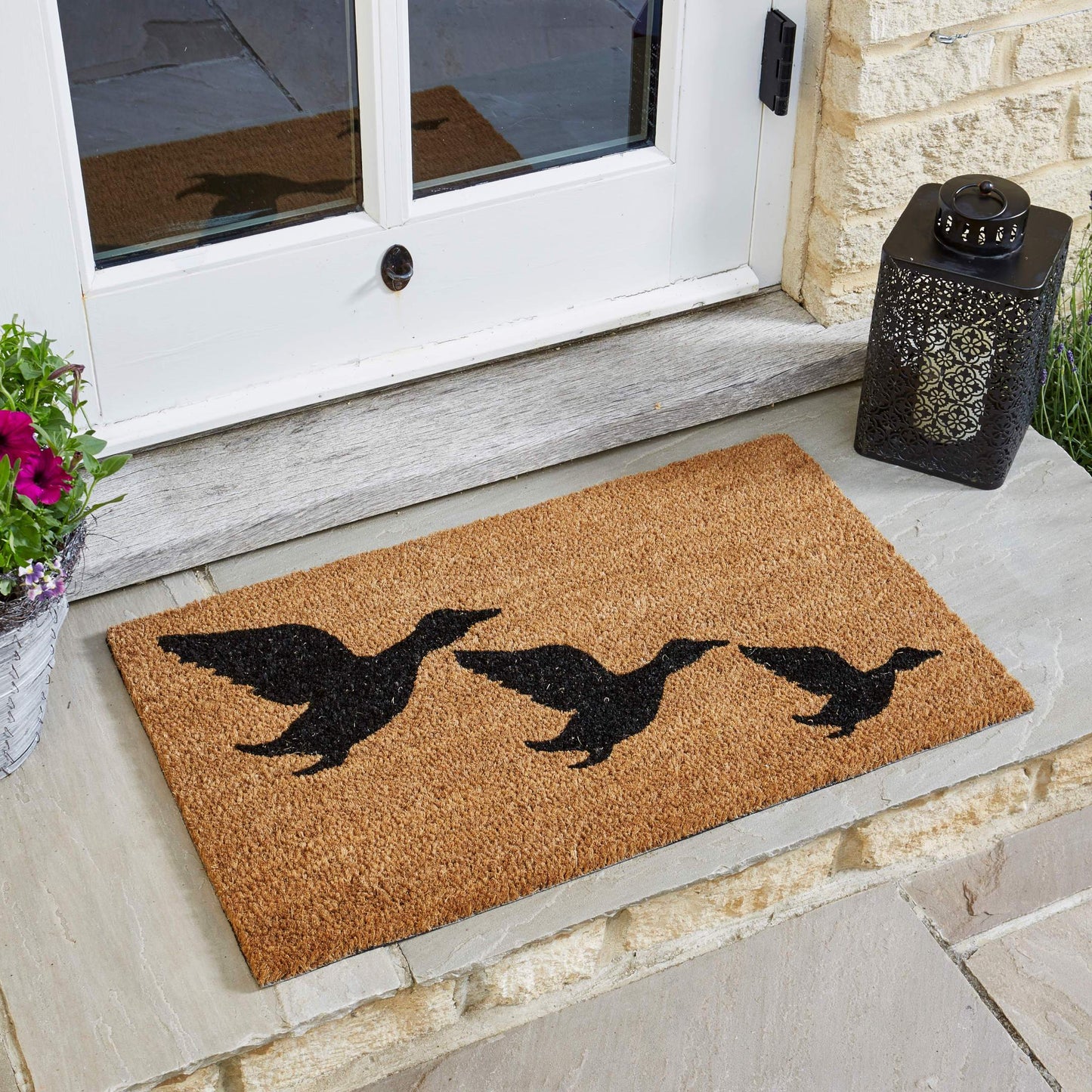 Rohožka Flying Geese zo série Décoir pred vchodovými dverami